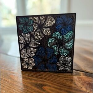 Hand painted floral design. 5X5 can be on table or hung. Blues & whites